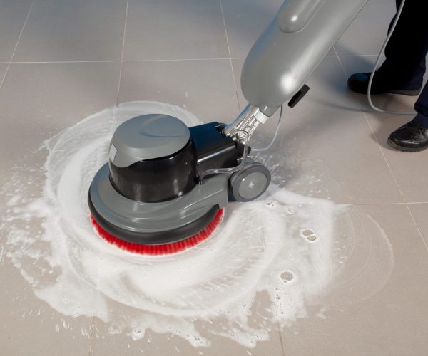 cleaning floor with machine